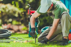 Man installing irrigation system